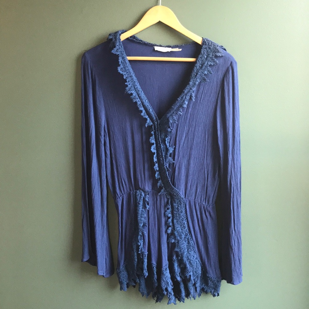 Dark blue knitted romper with bell sleeves